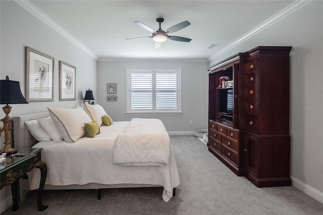 carpeted bedroom featuring ceiling fan and ornamental molding