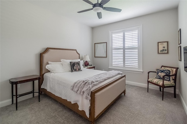 bedroom with light colored carpet and ceiling fan