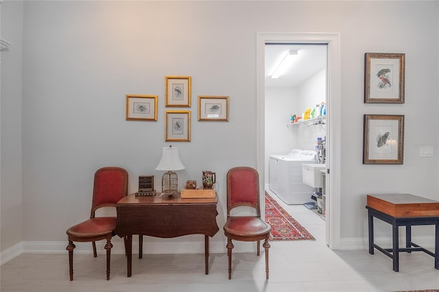 sitting room featuring washer and clothes dryer