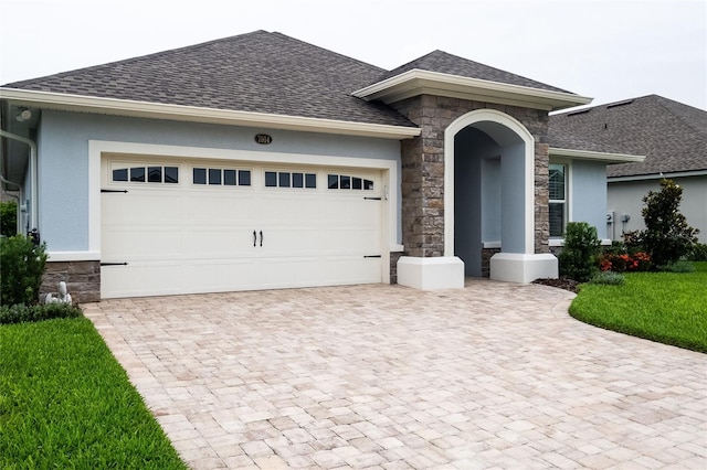 view of front facade with a garage and a front yard