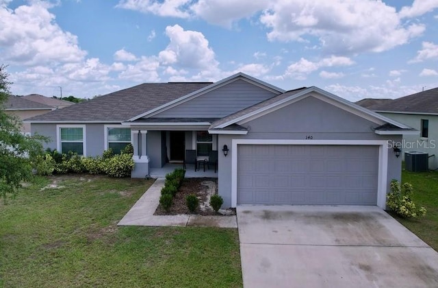 single story home featuring a garage, a front yard, and central AC unit