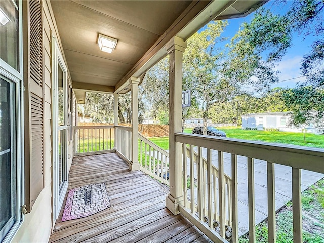 wooden deck with a yard