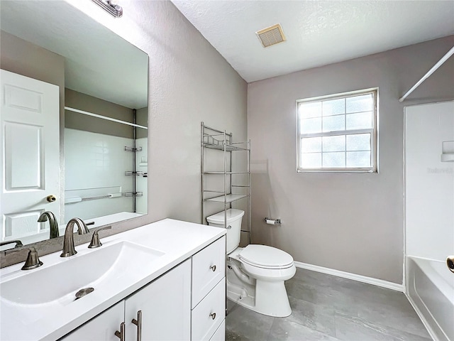 full bathroom with a textured ceiling, tile patterned floors, toilet, bathing tub / shower combination, and vanity