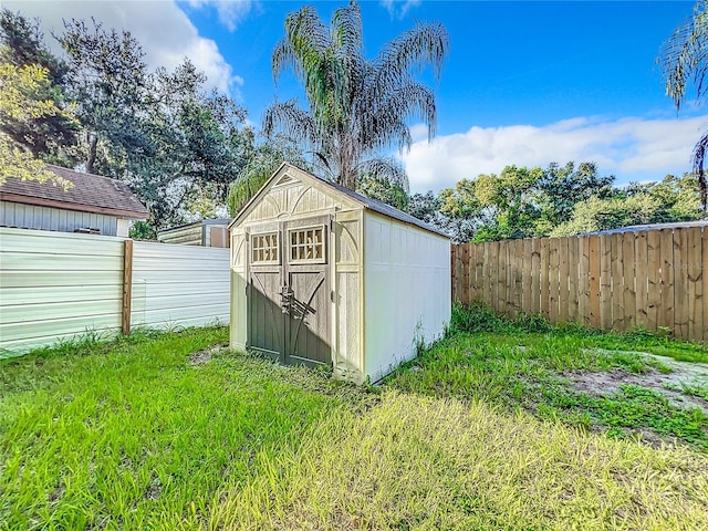 view of outbuilding featuring a lawn