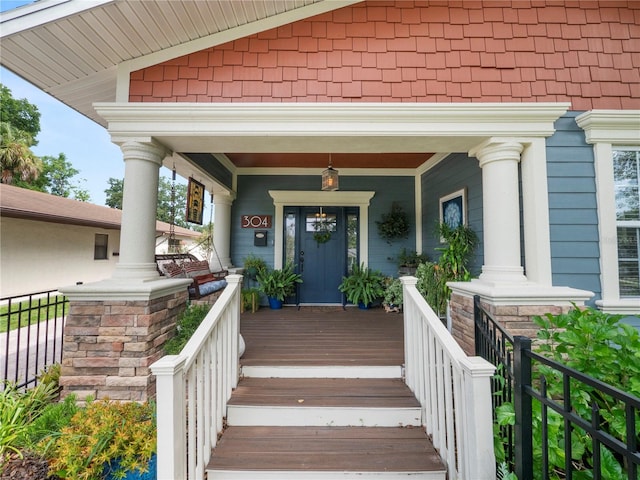 entrance to property featuring a porch