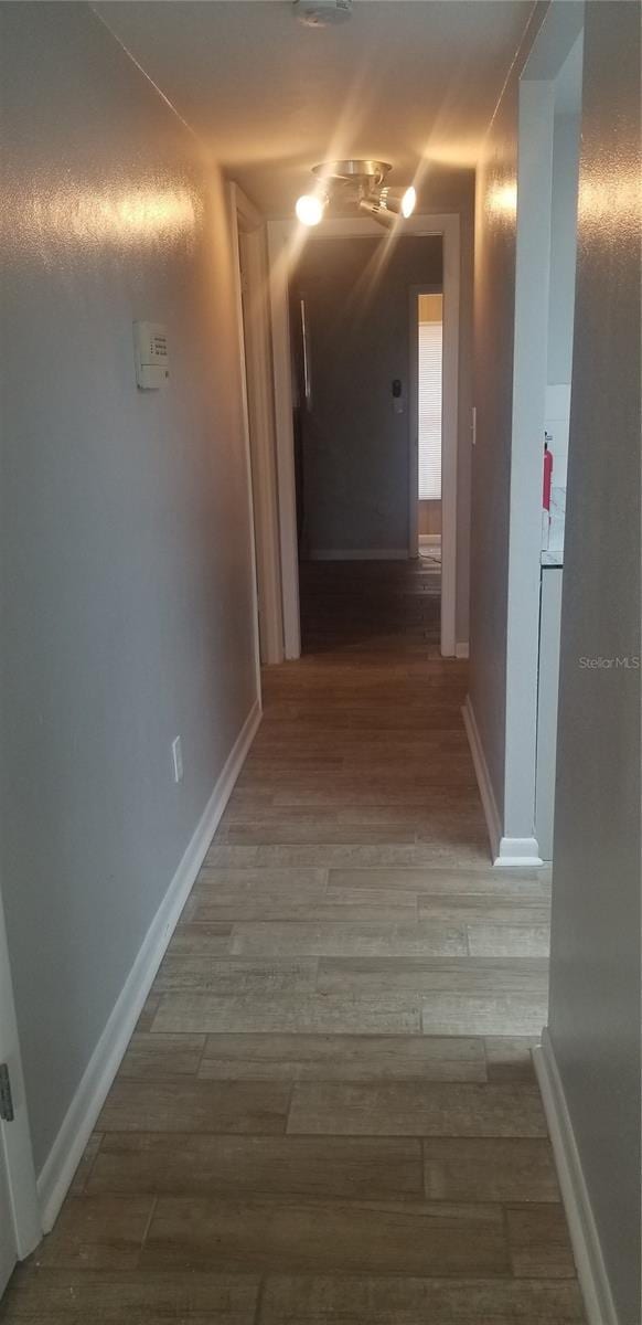 hallway featuring hardwood / wood-style floors