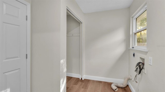 washroom featuring hookup for an electric dryer and hardwood / wood-style flooring