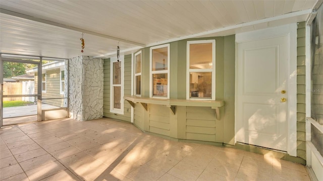 unfurnished sunroom featuring wooden ceiling