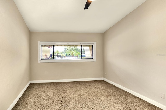 unfurnished room featuring a ceiling fan, carpet flooring, and baseboards