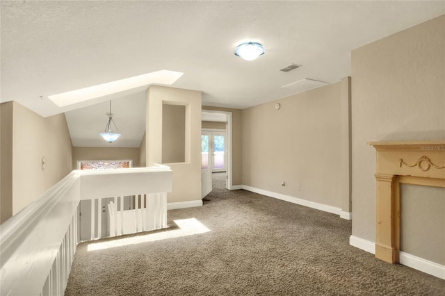 bonus room featuring carpet floors, lofted ceiling, visible vents, and baseboards