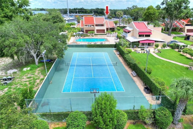 view of sport court with fence