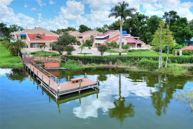 view of dock with a water view and a residential view