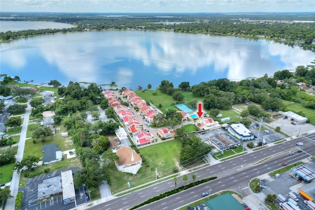 birds eye view of property with a water view