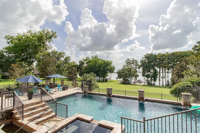 view of pool featuring a yard and a patio