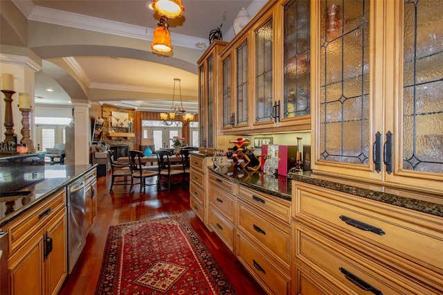 kitchen featuring pendant lighting, ornamental molding, dark wood-type flooring, and a wealth of natural light