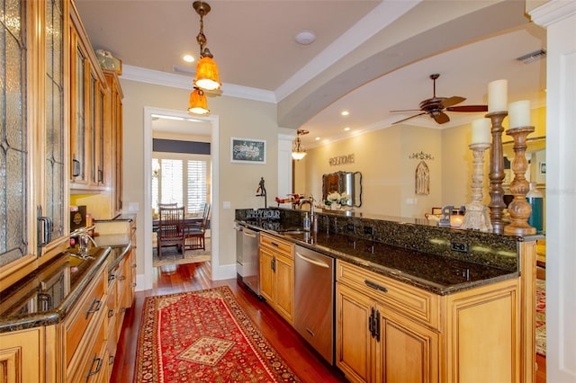 kitchen with dishwasher, dark hardwood / wood-style floors, ceiling fan, and dark stone counters