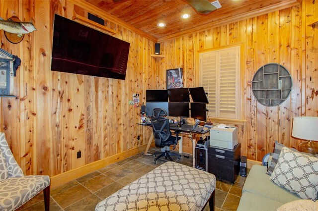 office area with dark tile patterned flooring, wood ceiling, and wood walls