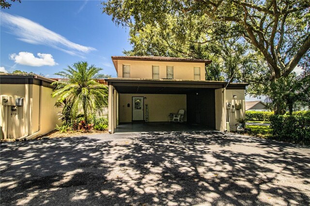 view of front of home featuring a carport