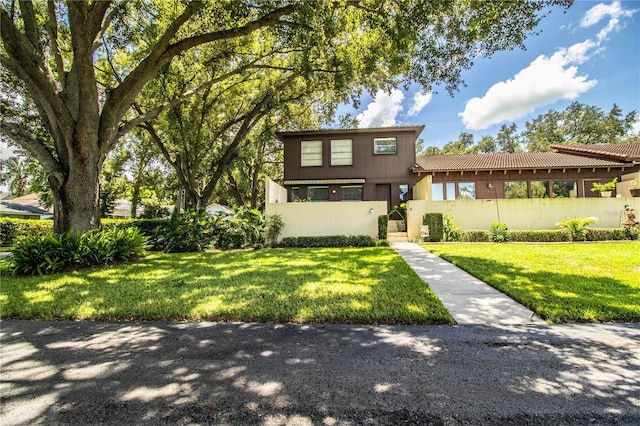 view of front of property with a front lawn