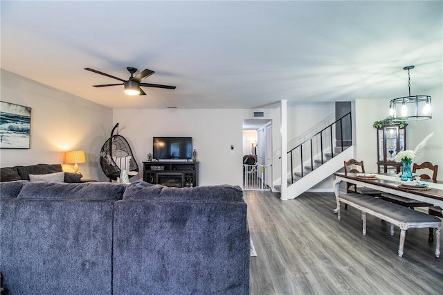 living room with hardwood / wood-style floors and ceiling fan