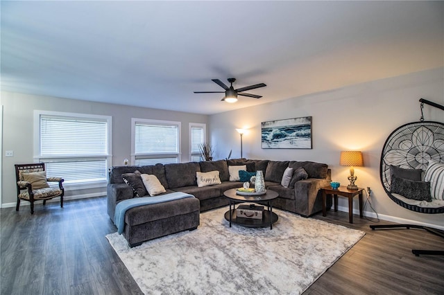 living room with dark hardwood / wood-style floors and ceiling fan