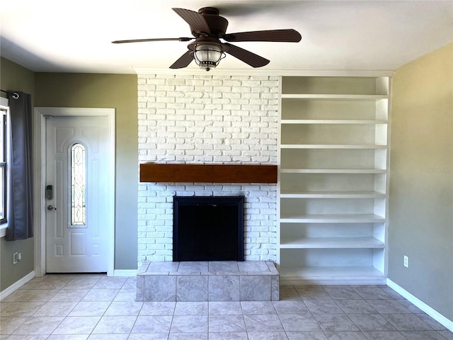 unfurnished living room featuring light tile patterned floors, a fireplace, built in features, and ceiling fan