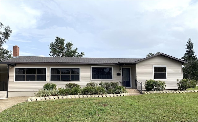 ranch-style house with a front yard