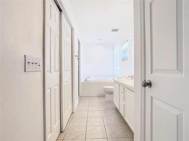 full bathroom with a garden tub, toilet, tile patterned flooring, visible vents, and vanity