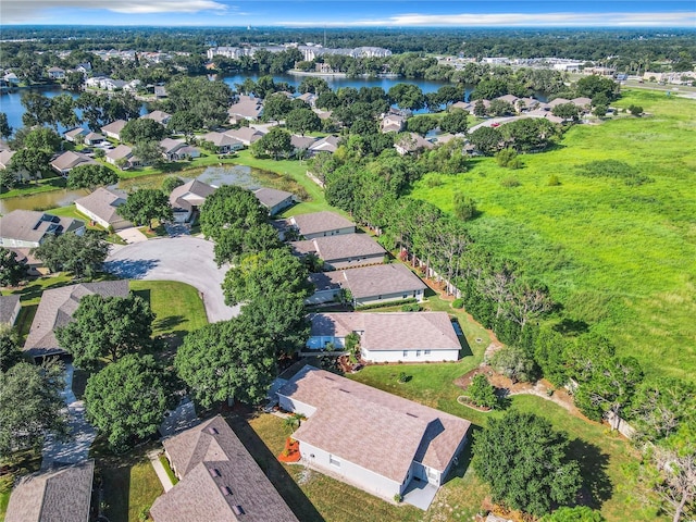 drone / aerial view featuring a residential view and a water view