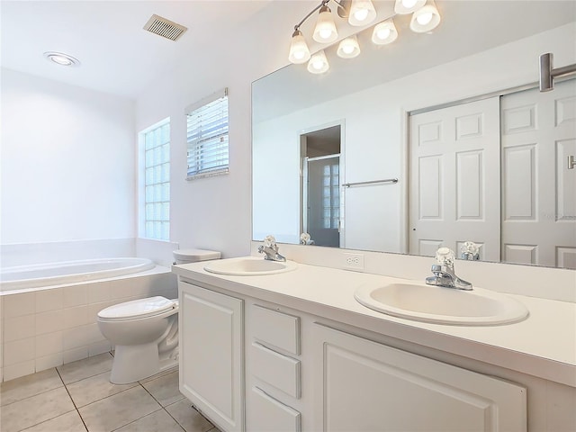 bathroom with visible vents, a sink, a shower stall, and tile patterned floors