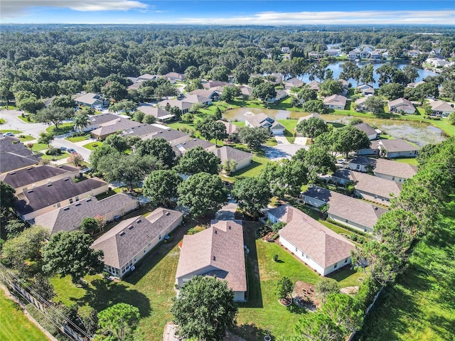 birds eye view of property featuring a water view and a residential view