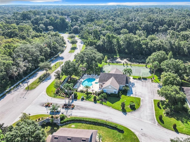 drone / aerial view featuring a view of trees