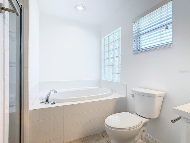 full bath with a bath, vanity, toilet, a stall shower, and tile patterned floors