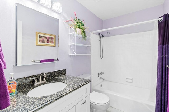 full bathroom featuring vanity, toilet, and shower / bath combo with shower curtain