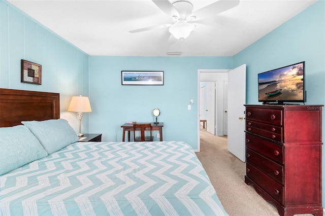 bedroom with visible vents, ceiling fan, and light carpet