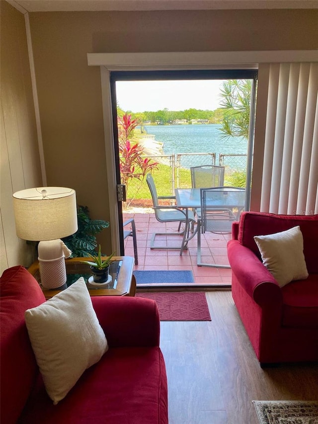 1920 E Edgewood Dr Unit G5, Lakeland, FL 33803 - living area featuring wood finished floors and a water view
