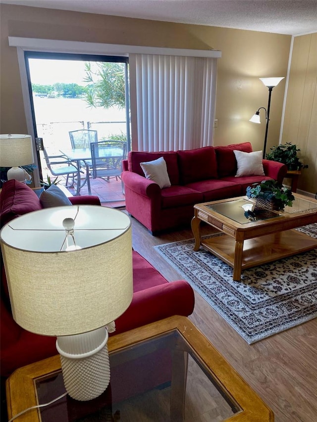 1920 E Edgewood Dr Unit G5, Lakeland, FL 33803 - living room featuring wood finished floors