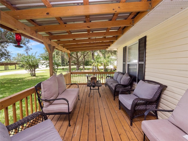 deck with outdoor lounge area and a yard