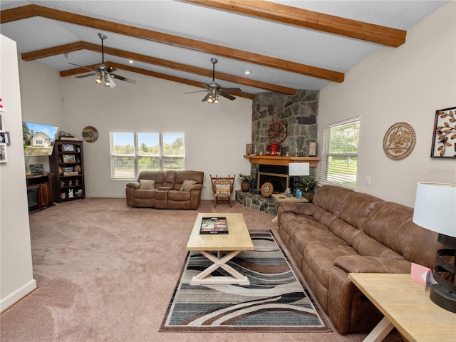 carpeted living room featuring a fireplace, ceiling fan, and a wealth of natural light