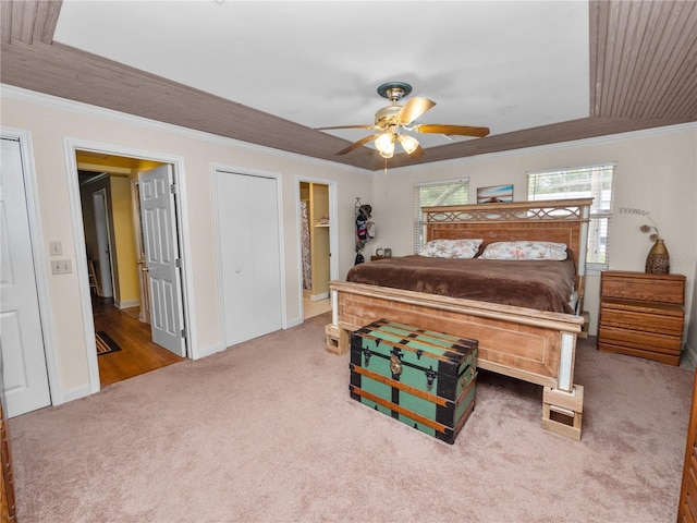 bedroom with carpet flooring, ceiling fan, and crown molding