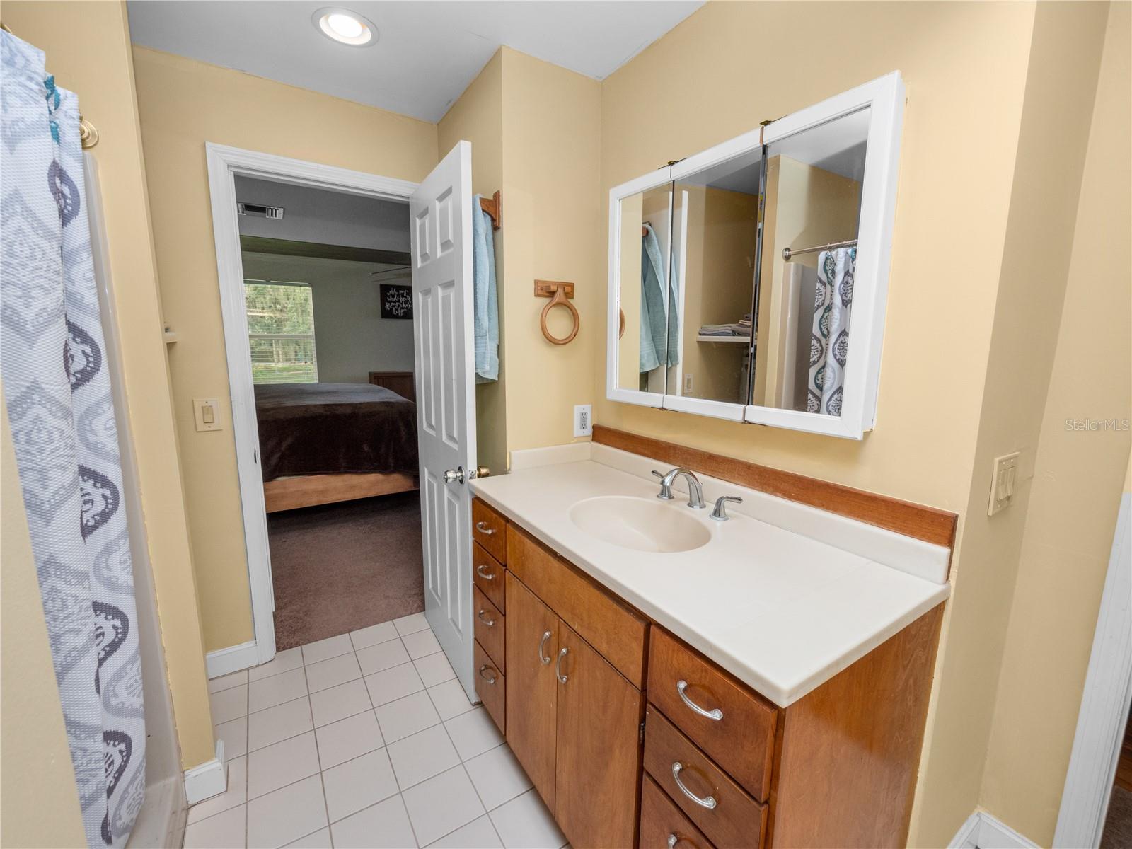 bathroom with vanity and tile patterned floors