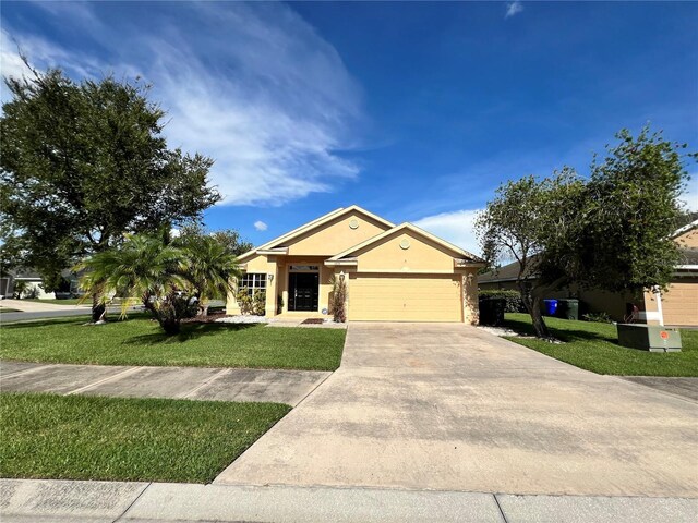 ranch-style home featuring a garage and a front lawn