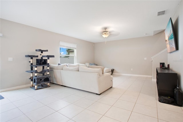 living room with light tile patterned flooring and ceiling fan