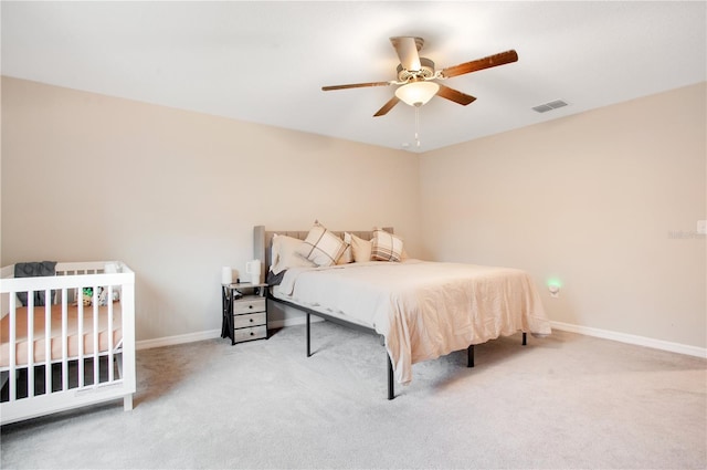 carpeted bedroom featuring ceiling fan