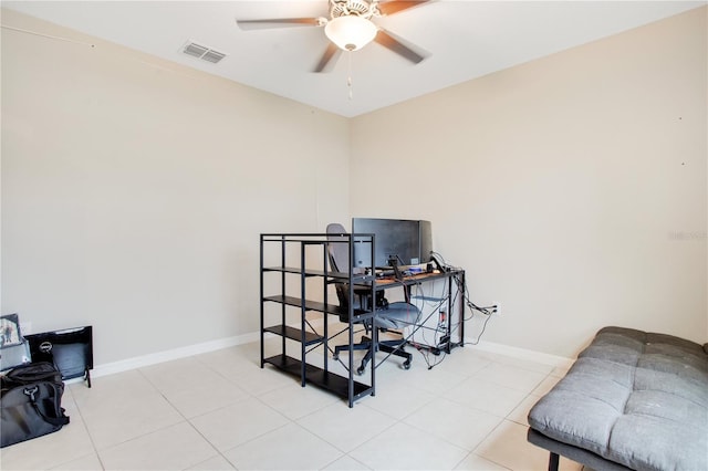 tiled office space featuring ceiling fan