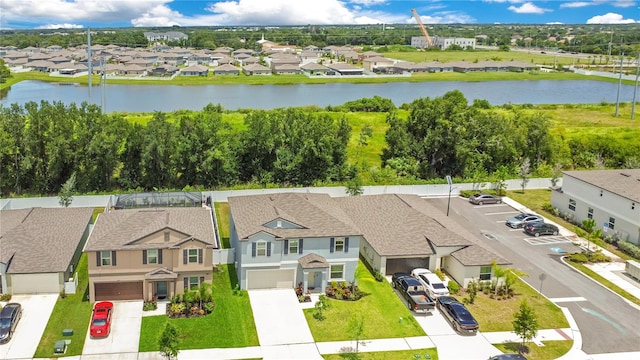 birds eye view of property with a water view