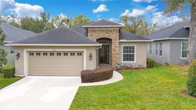 view of front facade featuring a garage and a front lawn