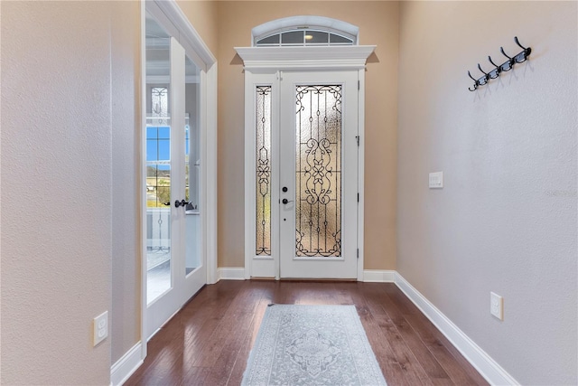 entrance foyer featuring dark wood-type flooring and french doors