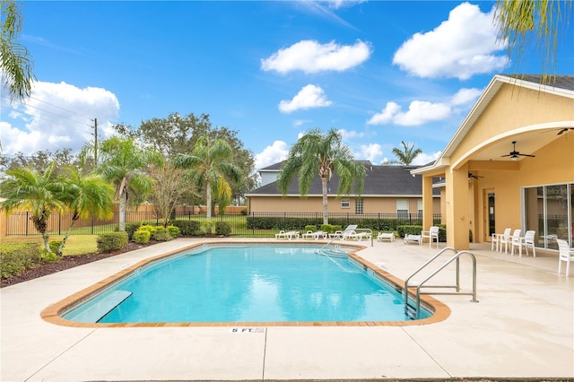 view of pool featuring a patio and ceiling fan