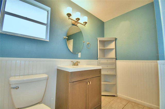 bathroom with tile patterned floors, vanity, and toilet